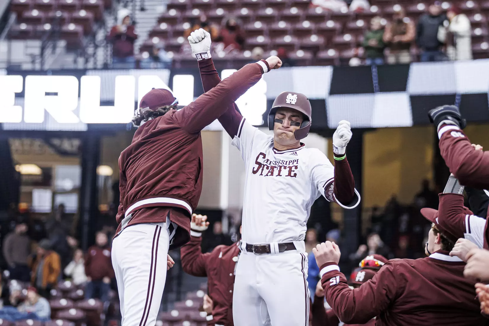 STARKVILLE, MS - February 26, 2022 - Mississippi State Infielder Kamren James (#6) and Mississippi State Infielder/Outfielder Matt Corder (#14) celebrate JamesÕs home run during the game between the Northern Kentucky Norse and the Mississippi State Bulldogs at Dudy Noble Field at Polk-Dement Stadium in Starkville, MS. Photo By Kevin Snyder