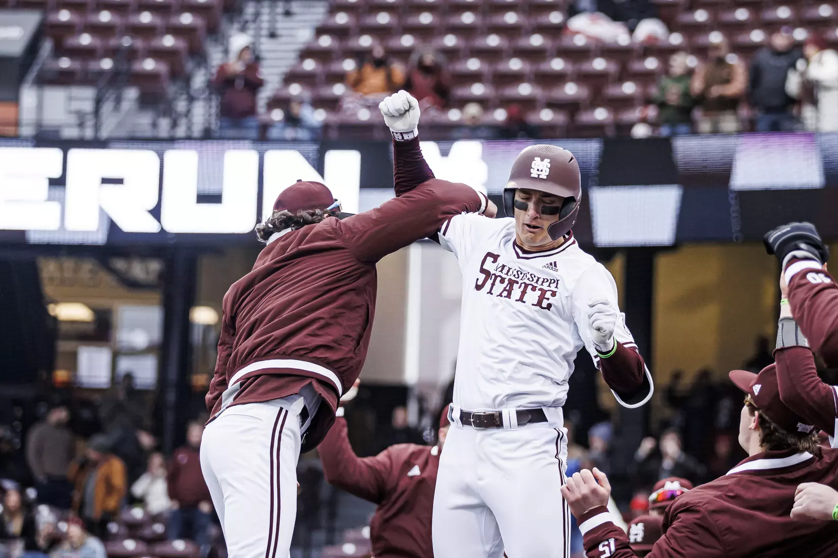 STARKVILLE, MS - February 26, 2022 - Mississippi State Infielder Kamren James (#6) and Mississippi State Infielder/Outfielder Matt Corder (#14) celebrate JamesÕs home run during the game between the Northern Kentucky Norse and the Mississippi State Bulldogs at Dudy Noble Field at Polk-Dement Stadium in Starkville, MS. Photo By Kevin Snyder