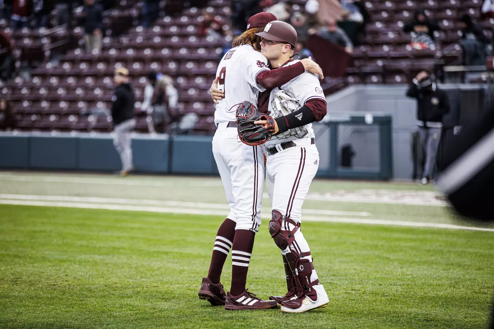 STARKVILLE, MS - February 26, 2022 - Mississippi State Pitcher Pico Kohn (#9) and Mississippi State Catcher Logan Tanner (#19) hug after the game between the Northern Kentucky Norse and the Mississippi State Bulldogs at Dudy Noble Field at Polk-Dement Stadium in Starkville, MS. Photo By Kevin Snyder