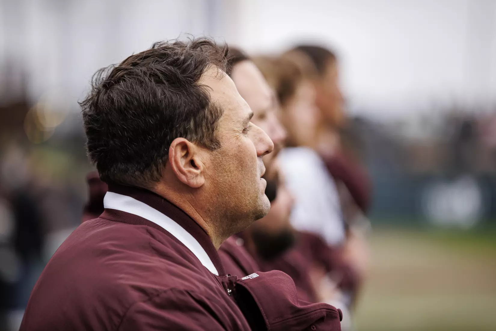 STARKVILLE, MS - February 27, 2022 - Mississippi State Head Coach Chris Lemonis during the National Anthem before the game between the Northern Kentucky Norse and the Mississippi State Bulldogs at Dudy Noble Field at Polk-Dement Stadium in Starkville, MS. Photo By Austin Perryman