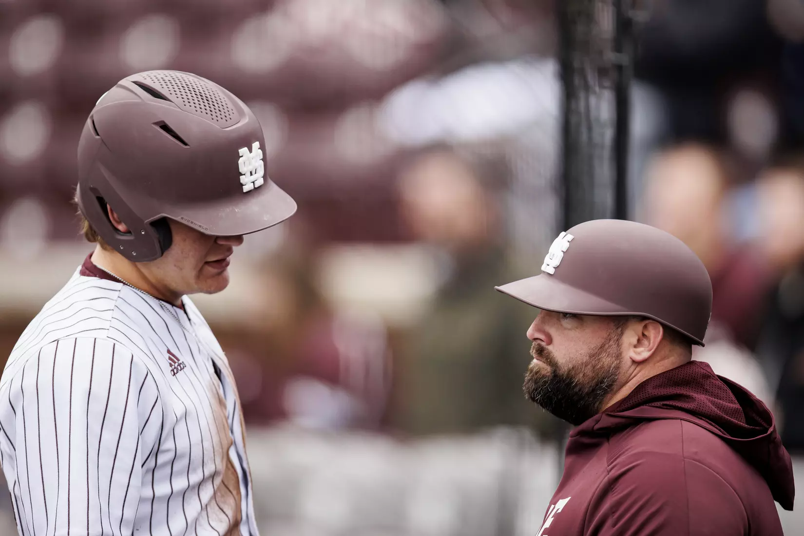 STARKVILLE, MS - February 27, 2022 - Mississippi State Infielder/Outfielder Hunter Hines (#44) and Baseball Camps Coordinator/Volunteer Assistant Kyle Cheesebrough during the game between the Northern Kentucky Norse and the Mississippi State Bulldogs at Dudy Noble Field at Polk-Dement Stadium in Starkville, MS. Photo By Austin Perryman