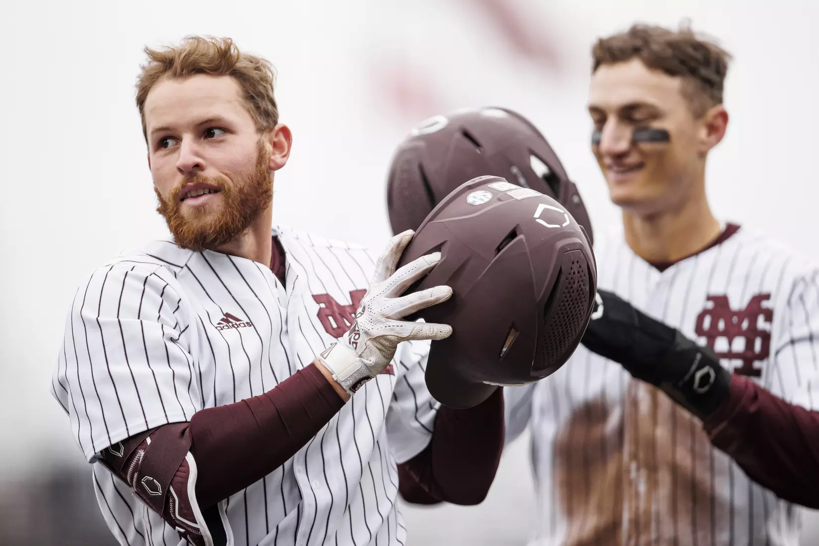 STARKVILLE, MS - February 27, 2022 - Mississippi State Infielder Luke Hancock (#20) and Mississippi State Infielder Kamren James (#6) celebrate during the game between the Northern Kentucky Norse and the Mississippi State Bulldogs at Dudy Noble Field at Polk-Dement Stadium in Starkville, MS. Photo By Austin Perryman