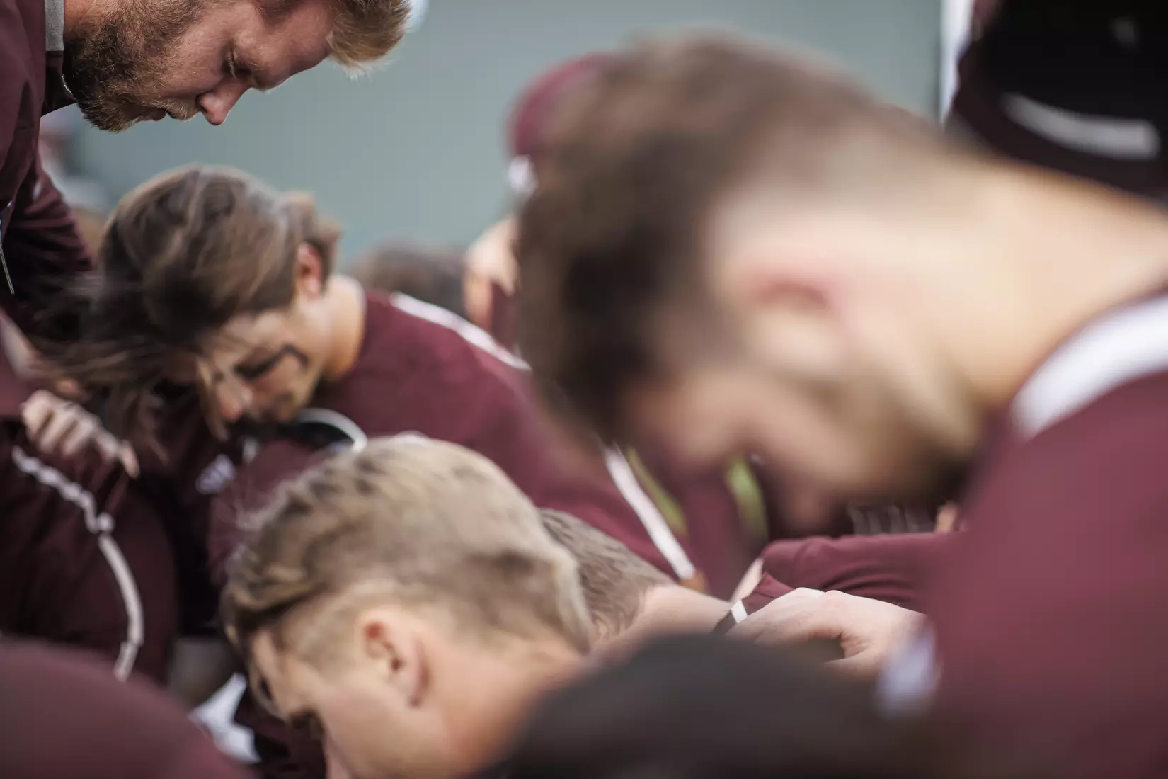 STARKVILLE, MS - March 23, 2022 - Mississippi State Pitcher Landon Sims (#23) prays during a team huddle before the game between the Southern Jaguars and the Mississippi State Bulldogs at Dudy Noble Field at Polk-Dement Stadium in Starkville, MS. Photo By Austin Perryman