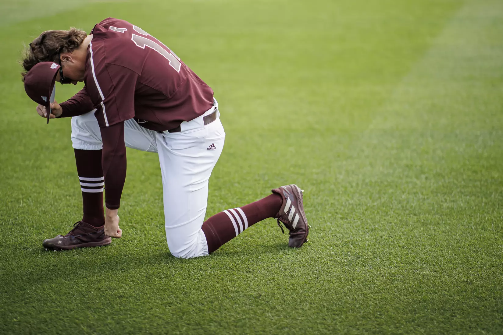STARKVILLE, MS - March 23, 2022 - Mississippi State Outfielder Kellum Clark (#11) prays before the game between the Southern Jaguars and the Mississippi State Bulldogs at Dudy Noble Field at Polk-Dement Stadium in Starkville, MS. Photo By Austin Perryman