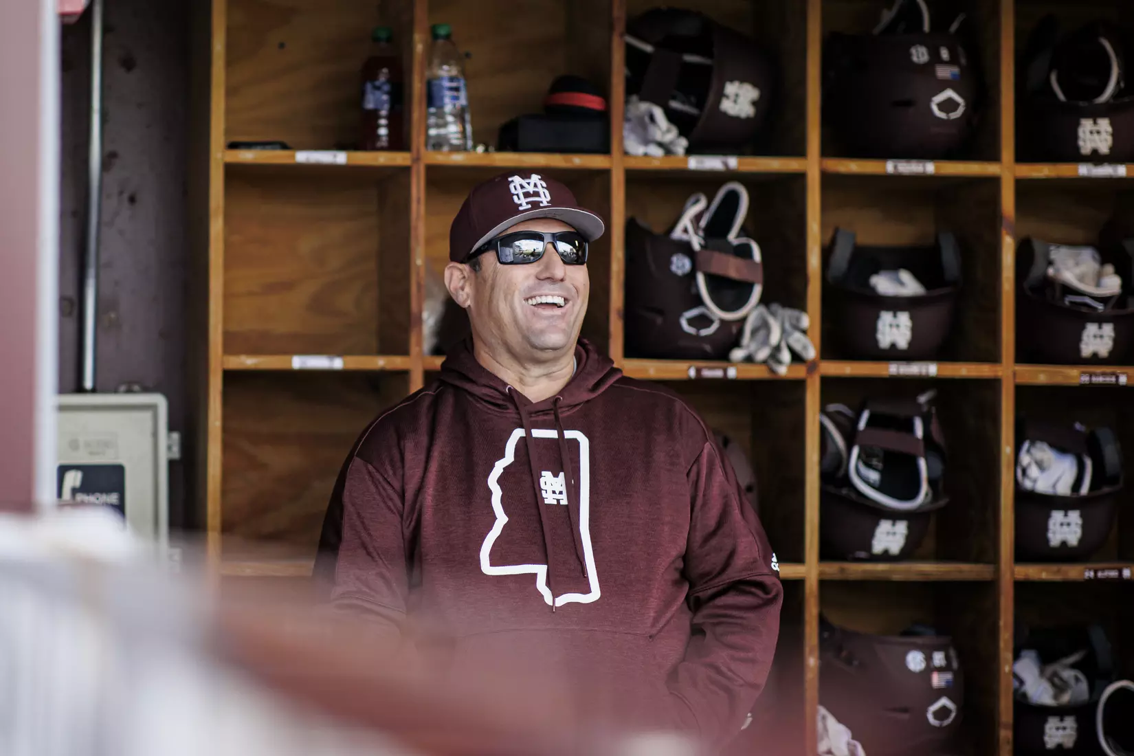 STARKVILLE, MS - March 23, 2022 - Mississippi State Head Coach Chris Lemonis laughs in the dugout before the game between the Southern Jaguars and the Mississippi State Bulldogs at Dudy Noble Field at Polk-Dement Stadium in Starkville, MS. Photo By Austin Perryman