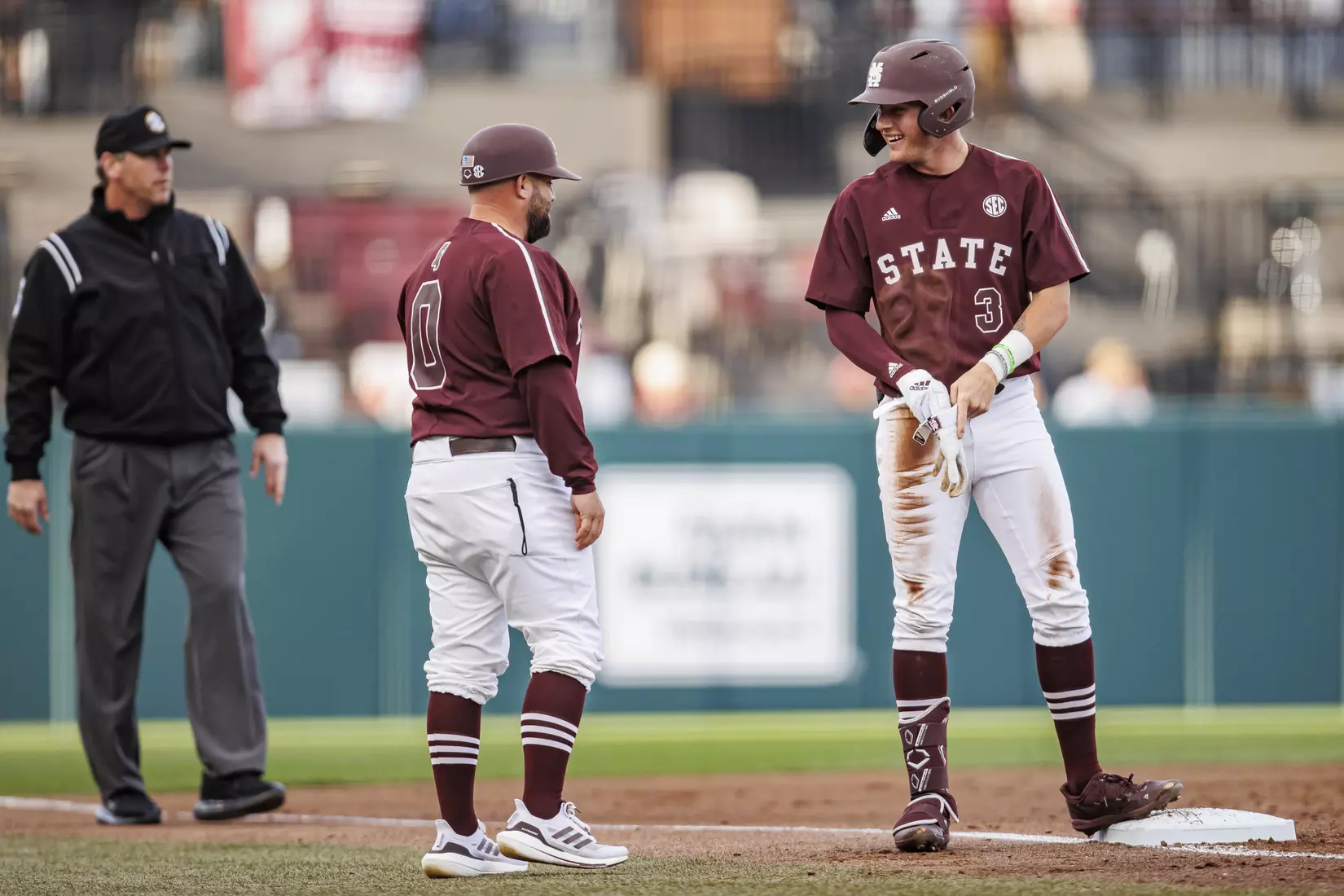 STARKVILLE, MS - March 23, 2022 - Mississippi State Baseball Camps Coordinator/Volunteer Assistant Kyle Cheesebrough and Outfielder Jess Davis (#3) during the game between the Southern Jaguars and the Mississippi State Bulldogs at Dudy Noble Field at Polk-Dement Stadium in Starkville, MS. Photo By Austin Perryman