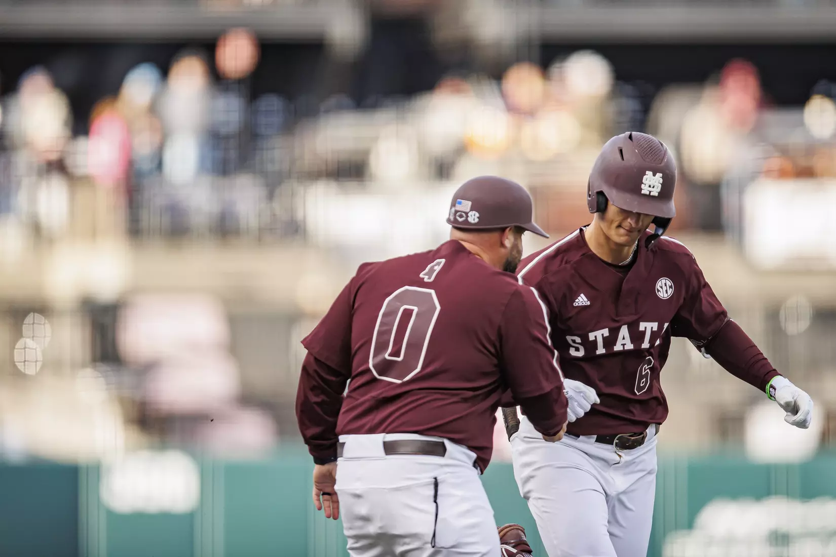 STARKVILLE, MS - March 23, 2022 - Mississippi State Baseball Camps Coordinator/Volunteer Assistant Kyle Cheesebrough and Infielder Kamren James (#6) during the game between the Southern Jaguars and the Mississippi State Bulldogs at Dudy Noble Field at Polk-Dement Stadium in Starkville, MS. Photo By Austin Perryman
