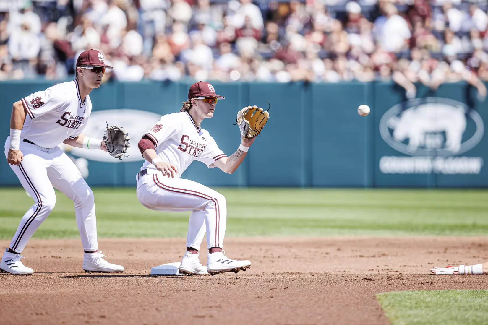 STARKVILLE, MS - March 26, 2022 - Mississippi State Infielder Lane Forsythe (#43) and Mississippi State Infielder Kamren James (#6) during the game between the Alabama Crimson Tide and the Mississippi State Bulldogs at Dudy Noble Field at Polk-Dement Stadium in Starkville, MS. Photo By Kevin Snyder