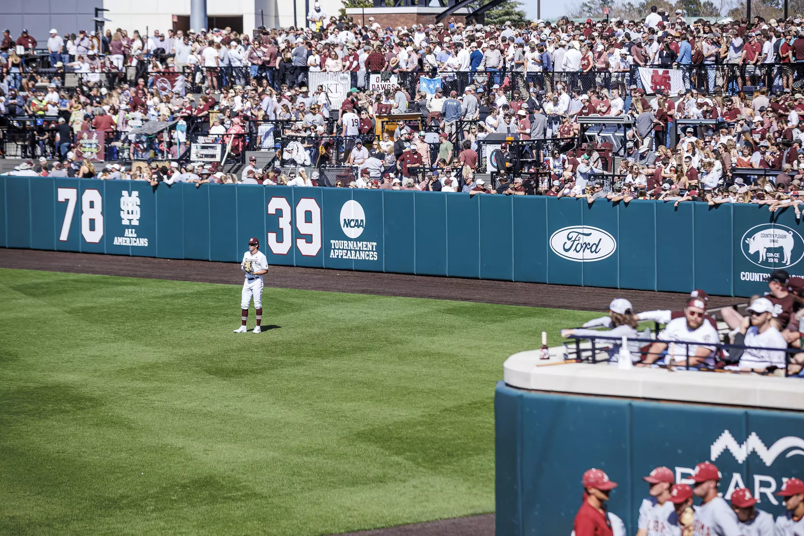 STARKVILLE, MS - March 26, 2022 - Mississippi State Outfielder Kellum Clark (#11) and Mississippi State fans during the game between the Alabama Crimson Tide and the Mississippi State Bulldogs at Dudy Noble Field at Polk-Dement Stadium in Starkville, MS. Photo By Kevin Snyder