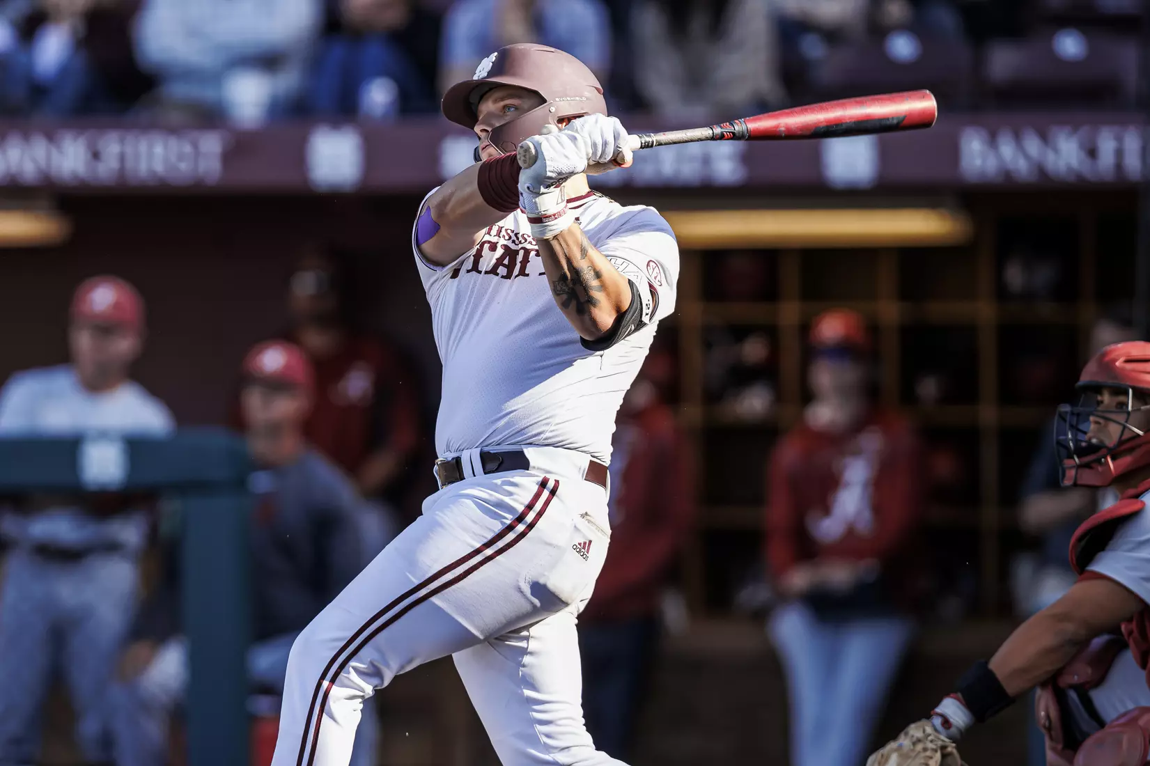STARKVILLE, MS - March 26, 2022 - Mississippi State Catcher Logan Tanner (#19) hits a game-tying home run during the game between the Alabama Crimson Tide and the Mississippi State Bulldogs at Dudy Noble Field at Polk-Dement Stadium in Starkville, MS. Photo By Kevin Snyder