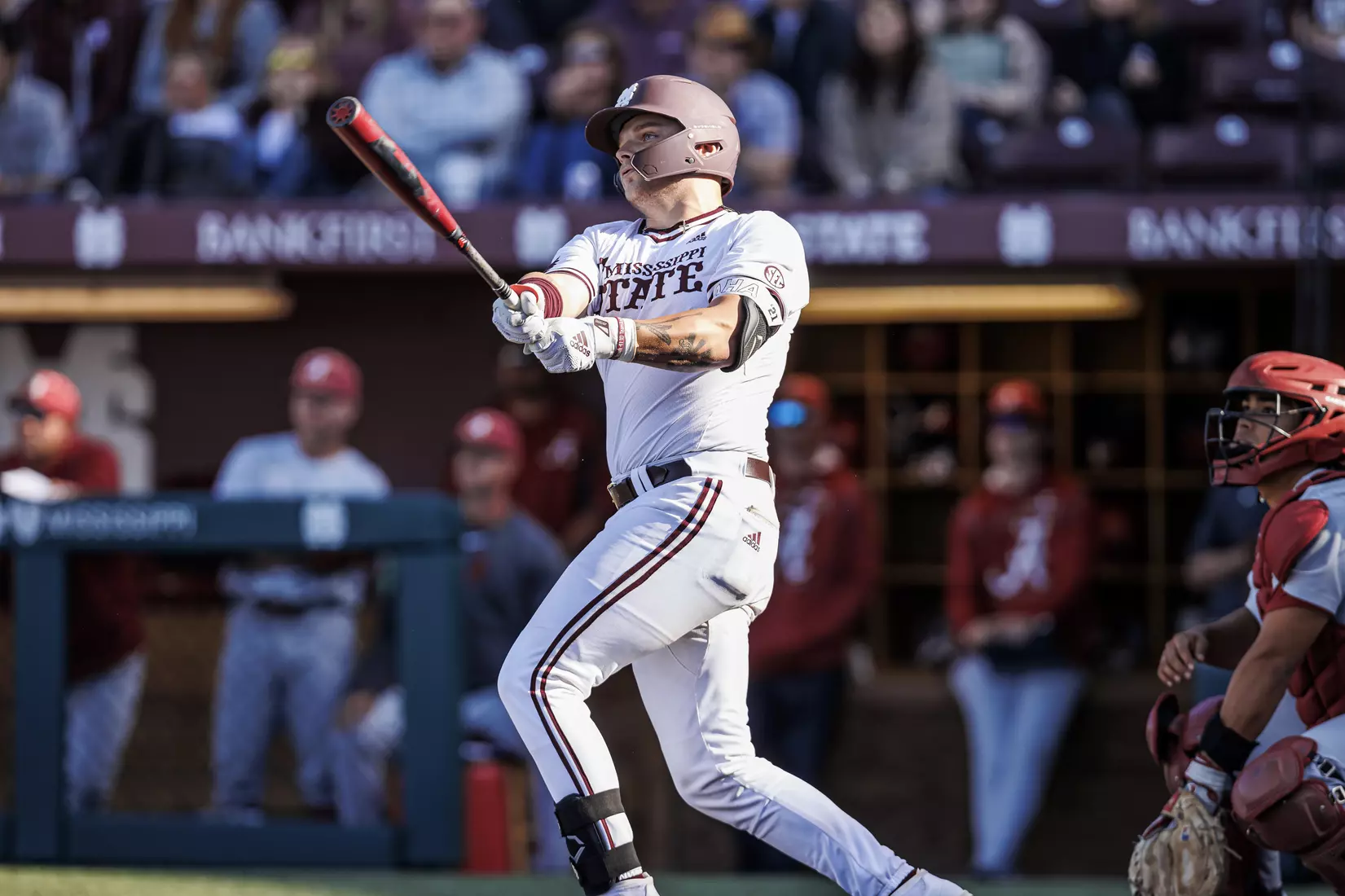 STARKVILLE, MS - March 26, 2022 - Mississippi State Catcher Logan Tanner (#19) hits a game-tying home run during the game between the Alabama Crimson Tide and the Mississippi State Bulldogs at Dudy Noble Field at Polk-Dement Stadium in Starkville, MS. Photo By Kevin Snyder
