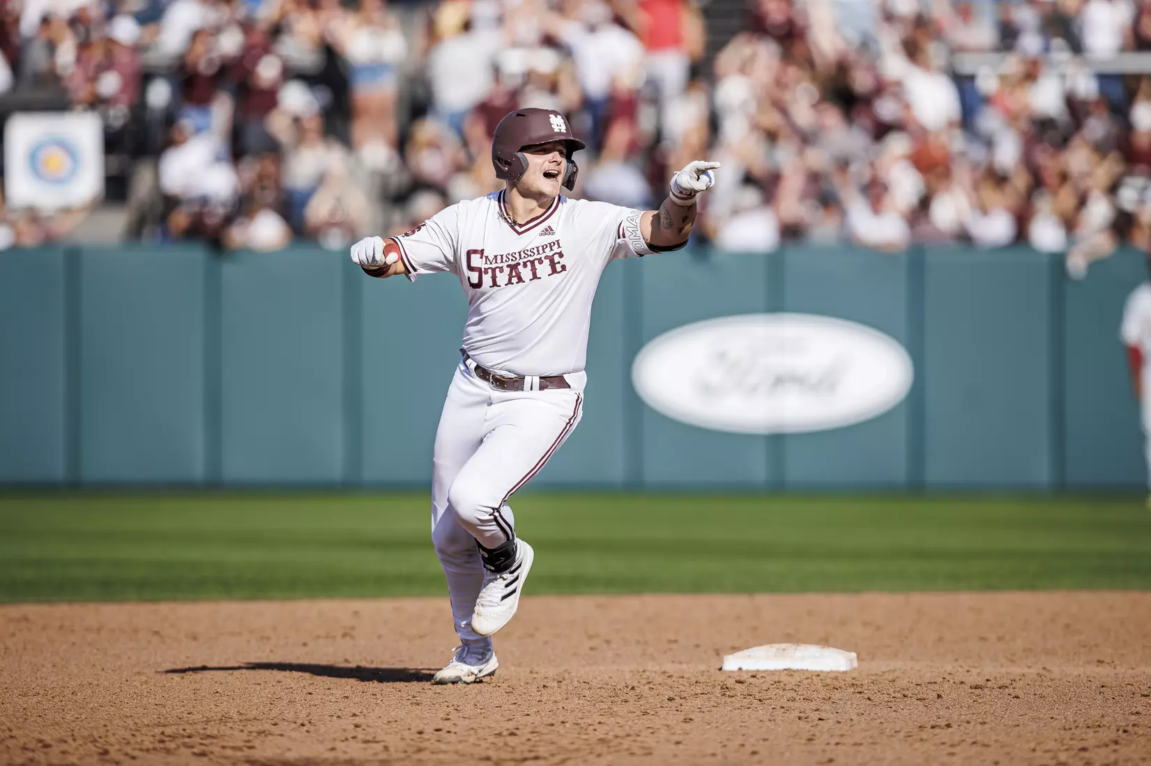 STARKVILLE, MS - March 26, 2022 - Mississippi State Catcher Logan Tanner (#19) circles the bases after hitting a game-tying home run during the game between the Alabama Crimson Tide and the Mississippi State Bulldogs at Dudy Noble Field at Polk-Dement Stadium in Starkville, MS. Photo By Kevin Snyder