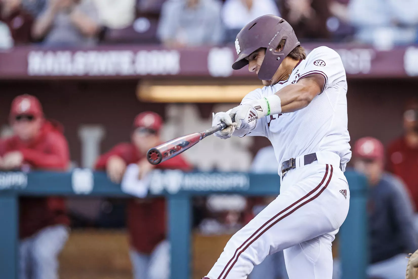 STARKVILLE, MS - March 26, 2022 - Mississippi State Infielder Tanner Leggett (#31) hits a walk-off single during the game between the Alabama Crimson Tide and the Mississippi State Bulldogs at Dudy Noble Field at Polk-Dement Stadium in Starkville, MS. Photo By Kevin Snyder