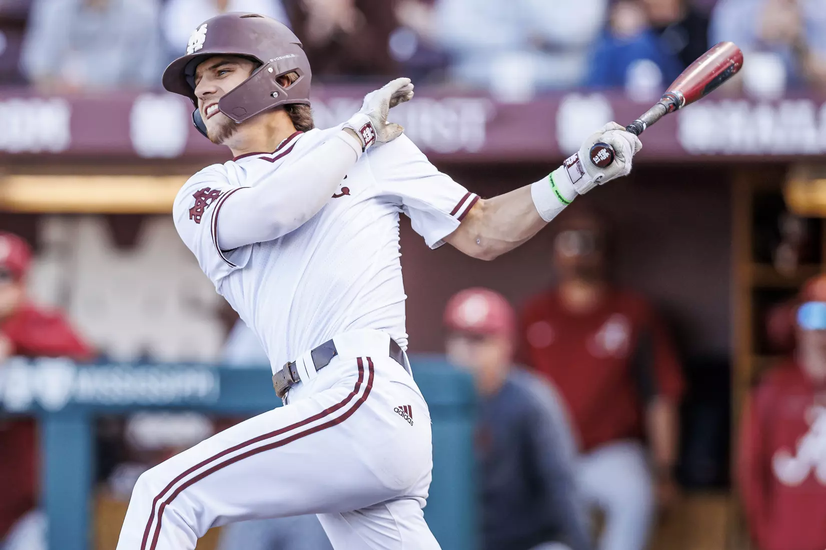 STARKVILLE, MS - March 26, 2022 - Mississippi State Infielder Tanner Leggett (#31) hits a walk-off single during the game between the Alabama Crimson Tide and the Mississippi State Bulldogs at Dudy Noble Field at Polk-Dement Stadium in Starkville, MS. Photo By Kevin Snyder