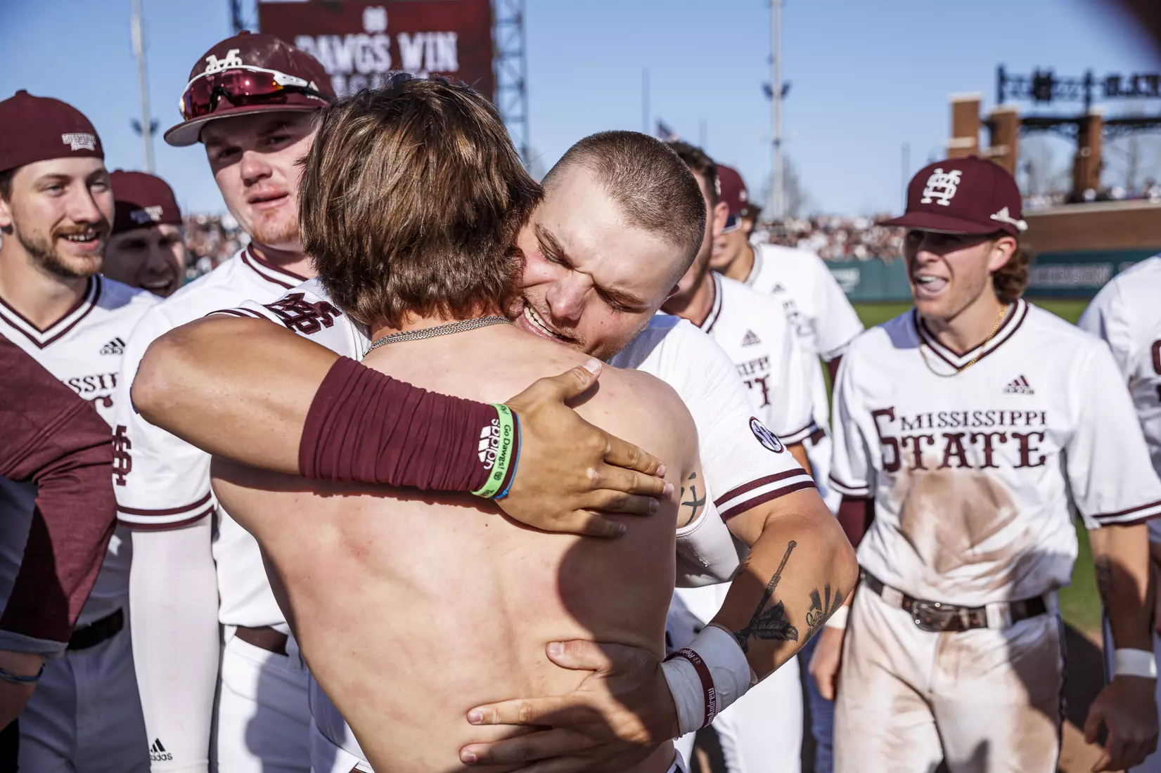 STARKVILLE, MS - March 26, 2022 - Mississippi State Catcher Logan Tanner (#19) hugs Mississippi State Infielder Tanner Leggett (#31) after LeggettÕs walk-off RBI single to end the game between the Alabama Crimson Tide and the Mississippi State Bulldogs at Dudy Noble Field at Polk-Dement Stadium in Starkville, MS. Photo By Kevin Snyder