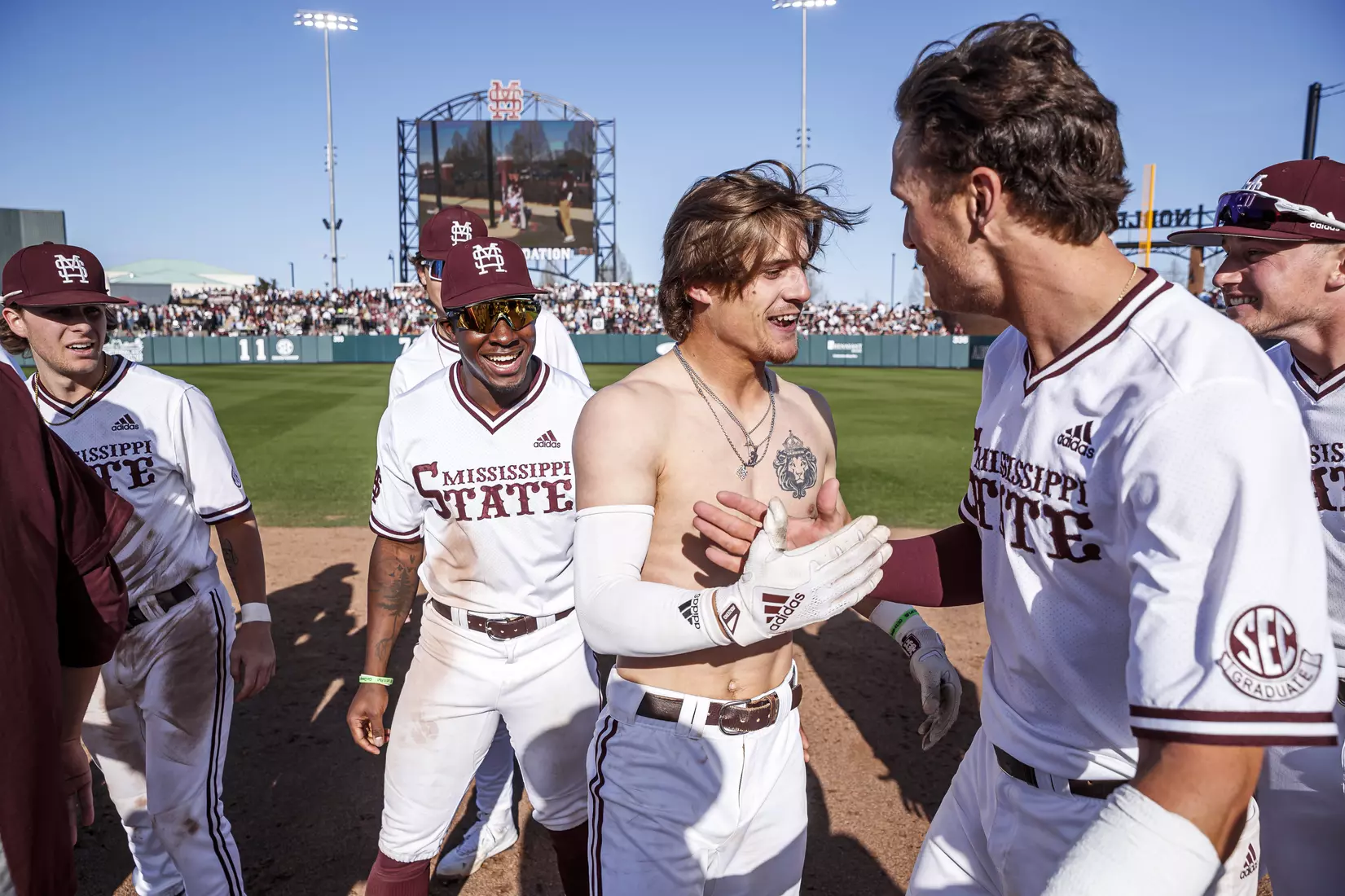 STARKVILLE, MS - March 26, 2022 - Mississippi State Infielder RJ Yeager (#4) hugs Mississippi State Infielder Tanner Leggett (#31) after LeggettÕs walk-off RBI single to end the game between the Alabama Crimson Tide and the Mississippi State Bulldogs at Dudy Noble Field at Polk-Dement Stadium in Starkville, MS. Photo By Kevin Snyder