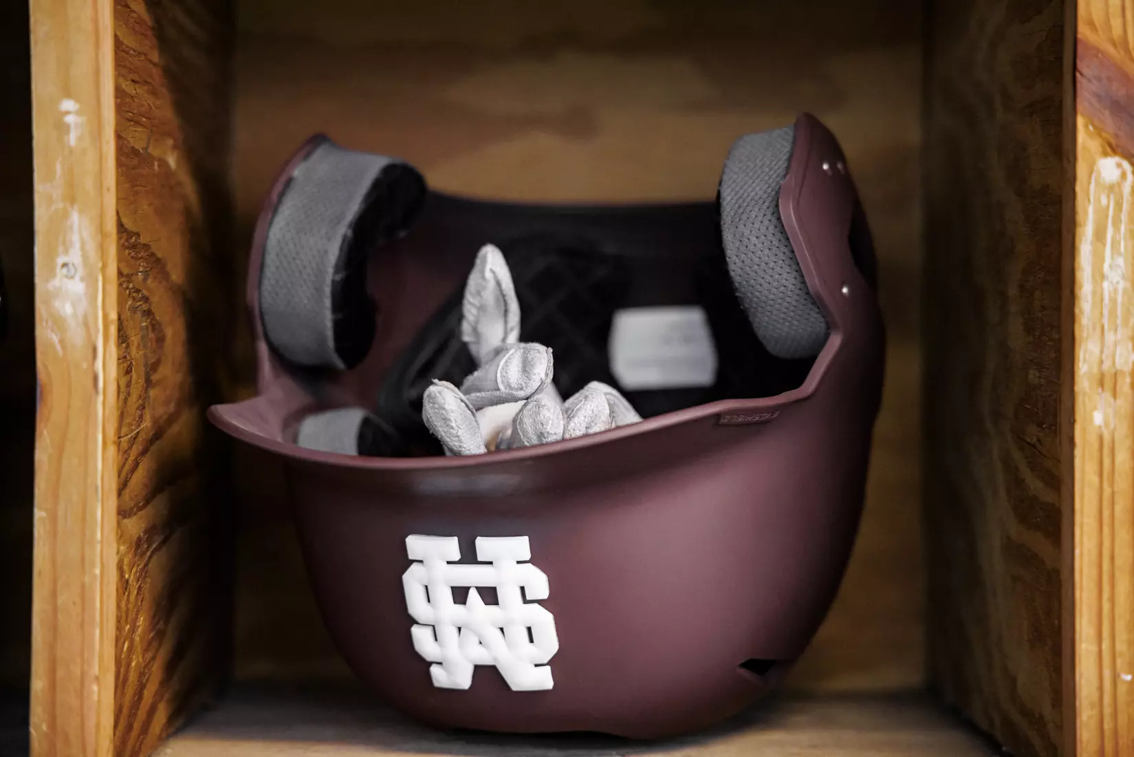 STARKVILLE, MS - April 08, 2022 - Batting helmets in the dugout before the game between the LSU Tigers and the Mississippi State Bulldogs at Dudy Noble Field at Polk-Dement Stadium in Starkville, MS. Photo By Austin Perryman