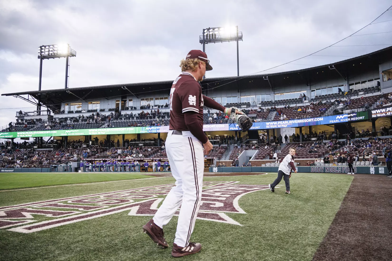 STARKVILLE, MS - April 08, 2022 - A fan throws out the ceremonial first pitch before the game between the LSU Tigers and the Mississippi State Bulldogs at Dudy Noble Field at Polk-Dement Stadium in Starkville, MS. Photo By Austin Perryman