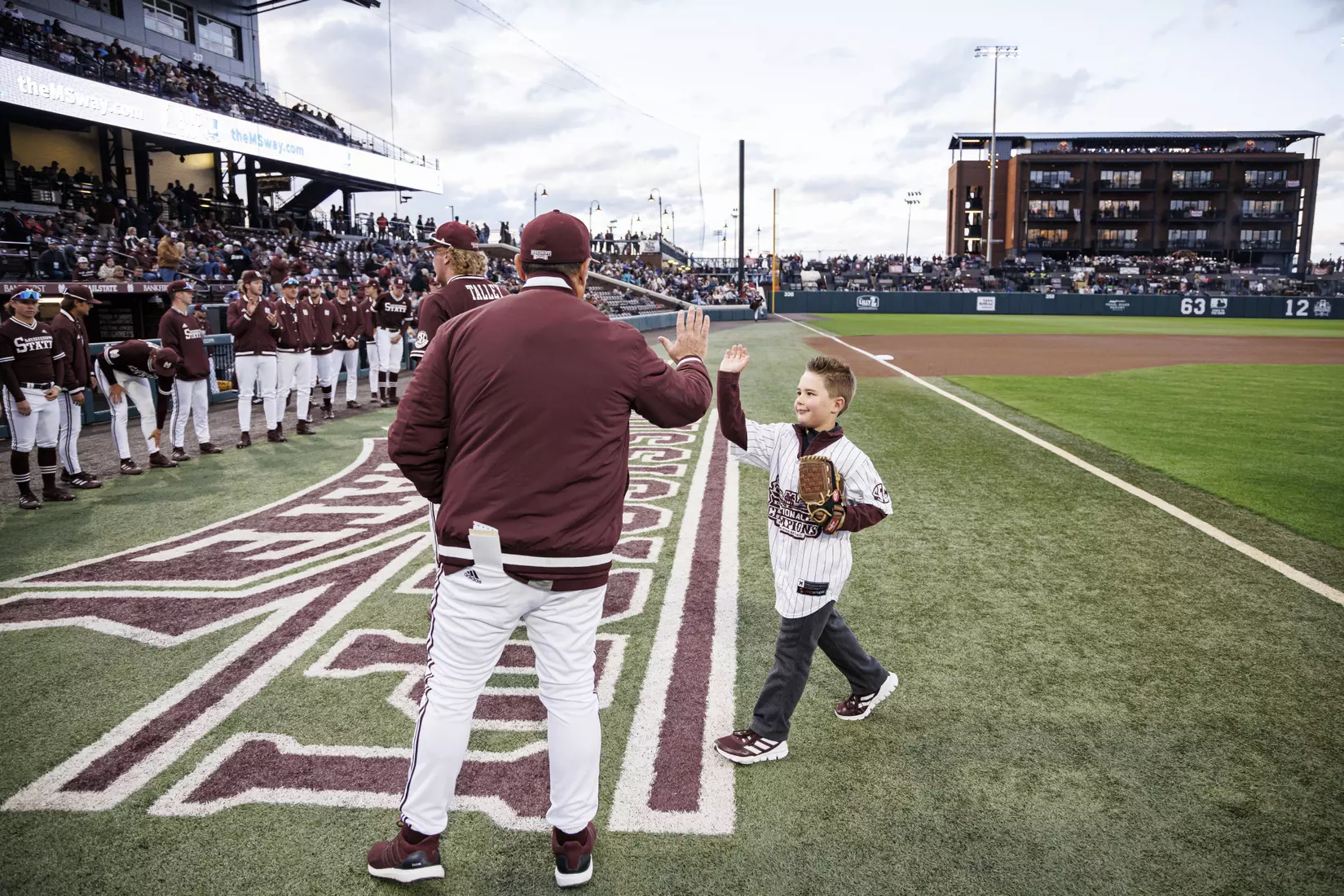 STARKVILLE, MS - April 08, 2022 - A fan throws out the ceremonial first pitch before the game between the LSU Tigers and the Mississippi State Bulldogs at Dudy Noble Field at Polk-Dement Stadium in Starkville, MS. Photo By Austin Perryman
