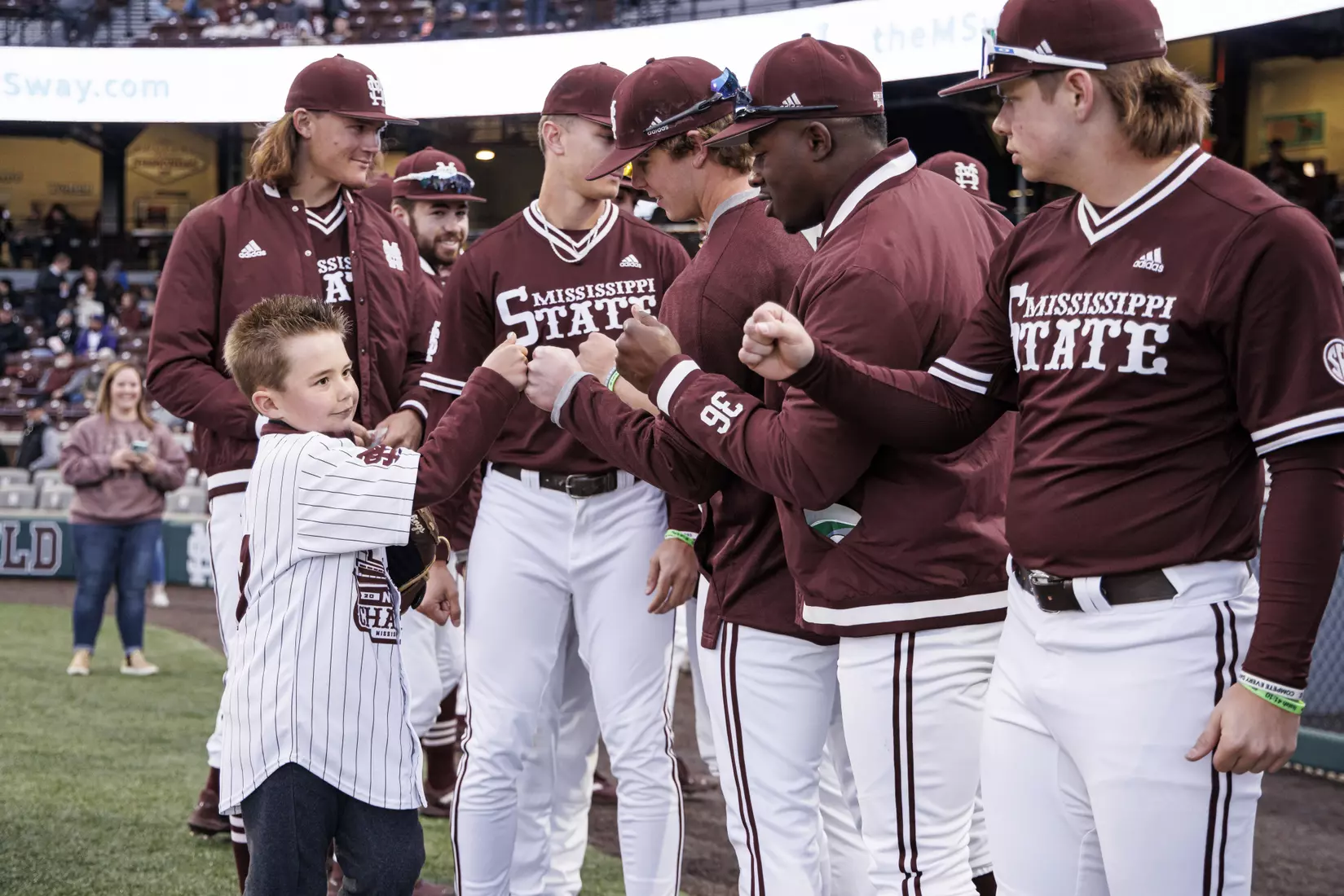 STARKVILLE, MS - April 08, 2022 - A fan throws out the ceremonial first pitch before the game between the LSU Tigers and the Mississippi State Bulldogs at Dudy Noble Field at Polk-Dement Stadium in Starkville, MS. Photo By Austin Perryman