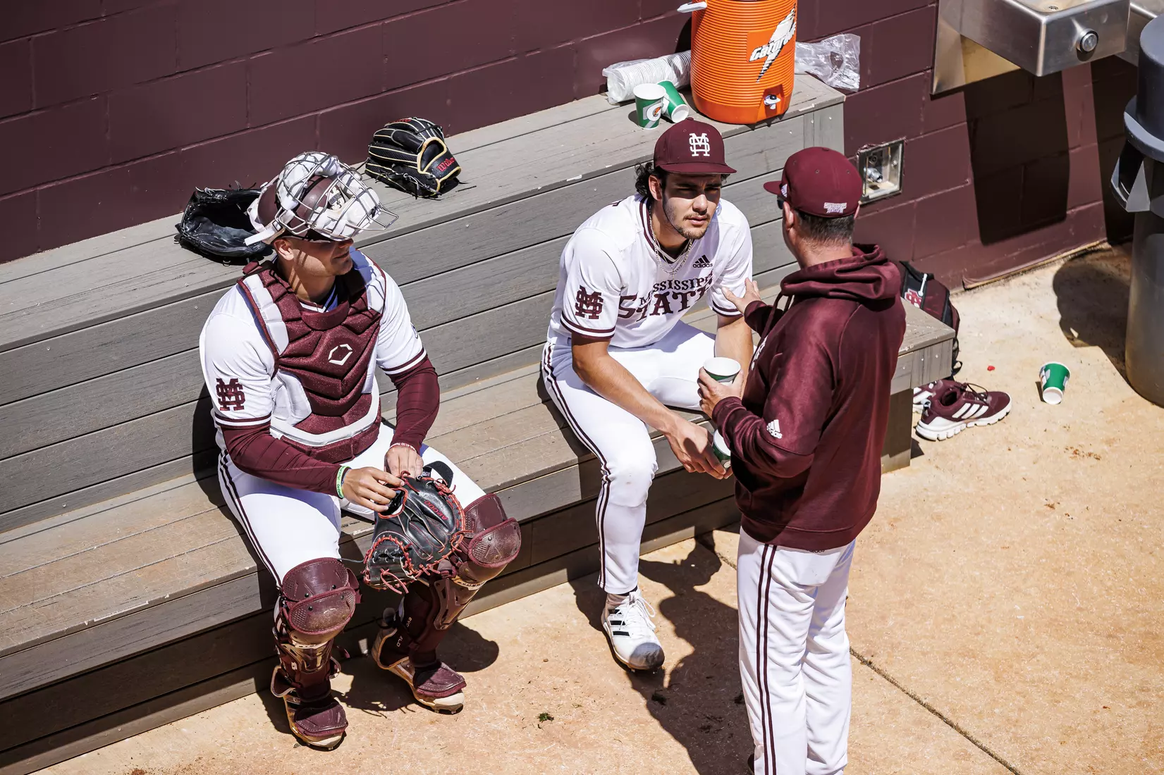 STARKVILLE, MS - April 09, 2022 - Mississippi State Catcher Logan Tanner (#19), Mississippi State Pitcher Parker Stinnett (#32), and Mississippi State Assistant Coach Scott Foxhall before the game between the LSU Tigers and the Mississippi State Bulldogs at Dudy Noble Field at Polk-Dement Stadium in Starkville, MS. Photo By Mississippi State Athletics