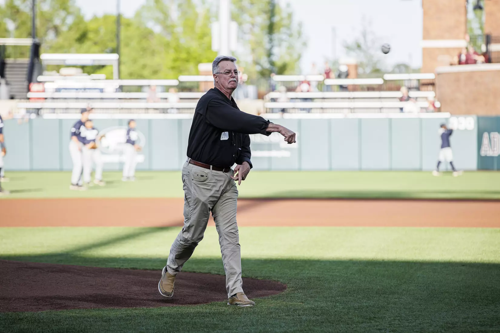 STARKVILLE, MS - April 19, 2022 - Joe Shumaker, on behalf of the Risk Management and Insurance Program in the College of Business, throws out the ceremonial first pitch before the game between the Jackson State Tigers and the Mississippi State Bulldogs at Dudy Noble Field at Polk-Dement Stadium in Starkville, MS. Photo By Kevin Snyder