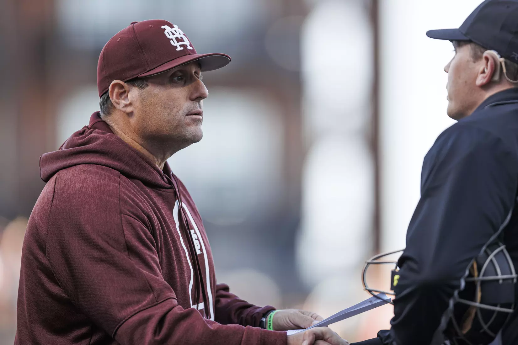STARKVILLE, MS - April 19, 2022 - Mississippi State Head Coach Chris Lemonis and umpire during the game between the Jackson State Tigers and the Mississippi State Bulldogs at Dudy Noble Field at Polk-Dement Stadium in Starkville, MS. Photo By Kevin Snyder