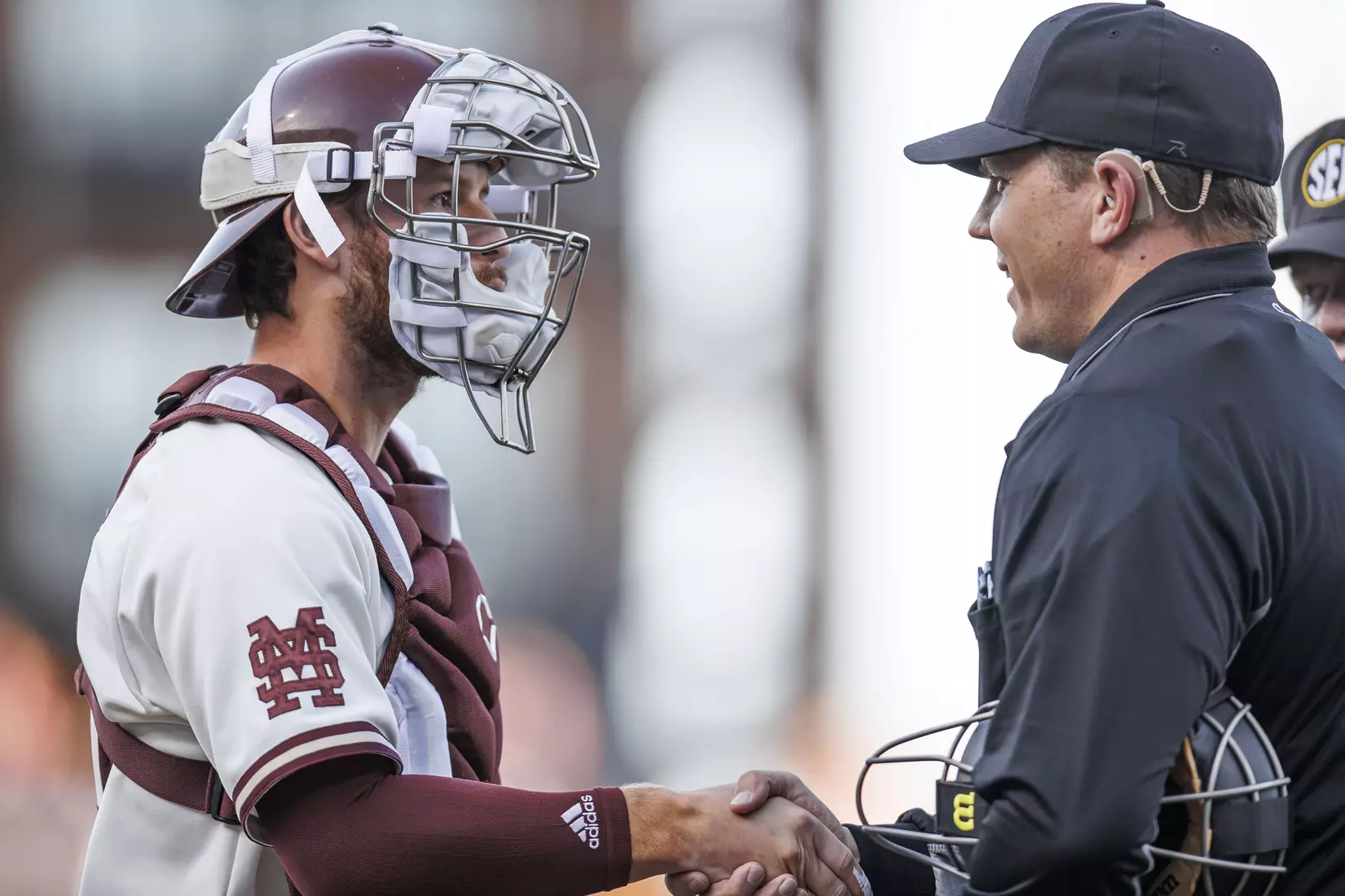 STARKVILLE, MS - April 19, 2022 - Mississippi State Infielder Luke Hancock (#20) and umpire during the game between the Jackson State Tigers and the Mississippi State Bulldogs at Dudy Noble Field at Polk-Dement Stadium in Starkville, MS. Photo By Kevin Snyder