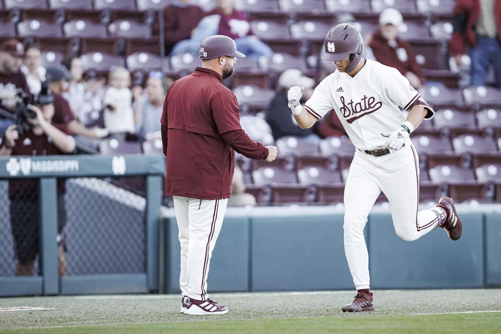 STARKVILLE, MS - April 19, 2022 - Mississippi State Baseball Camps Coordinator/Volunteer Assistant Kyle Cheesebrough and Infielder Kamren James (#6) during the game between the Jackson State Tigers and the Mississippi State Bulldogs at Dudy Noble Field at Polk-Dement Stadium in Starkville, MS. Photo By Kevin Snyder