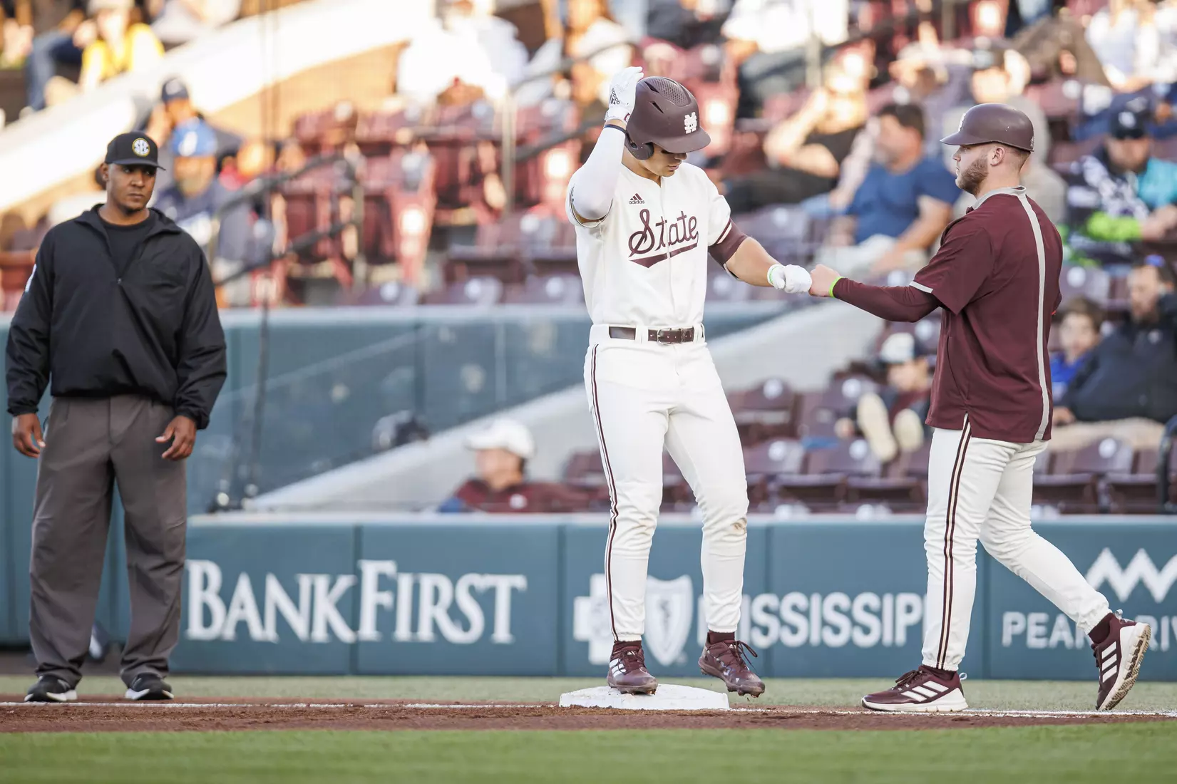 STARKVILLE, MS - April 19, 2022 - Mississippi State Infielder Slate Alford (#24) and Pitcher Landon Sims (#23) during the game between the Jackson State Tigers and the Mississippi State Bulldogs at Dudy Noble Field at Polk-Dement Stadium in Starkville, MS. Photo By Sloane Bush