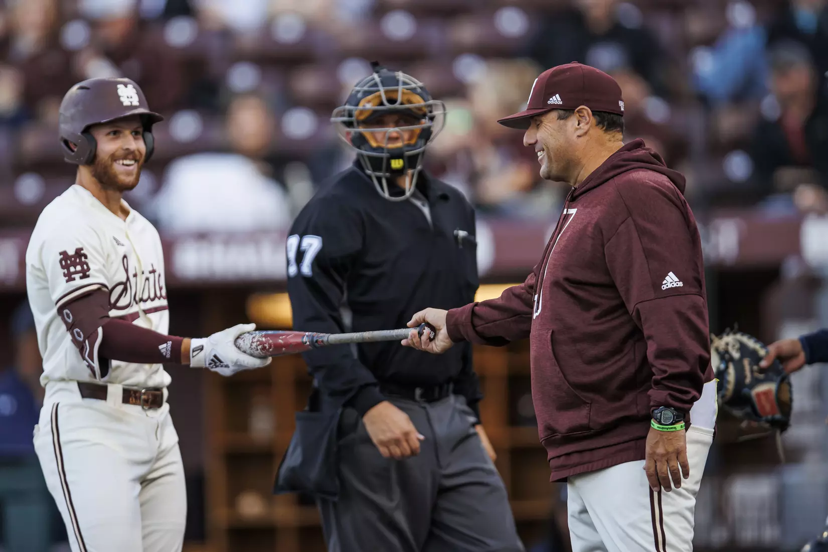 STARKVILLE, MS - April 19, 2022 - Mississippi State Infielder Luke Hancock (#20) and Head Coach Chris Lemonis during the game between the Jackson State Tigers and the Mississippi State Bulldogs at Dudy Noble Field at Polk-Dement Stadium in Starkville, MS. Photo By Sloane Bush