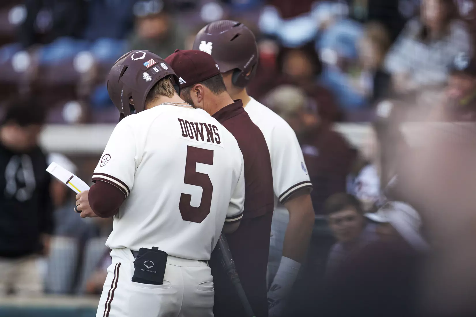 STARKVILLE, MS - April 19, 2022 - Mississippi State Infielder/Outfielder Aaron Downs (#5) and Assistant Coach Jake Gautreau during the game between the Jackson State Tigers and the Mississippi State Bulldogs at Dudy Noble Field at Polk-Dement Stadium in Starkville, MS. Photo By Sloane Bush
