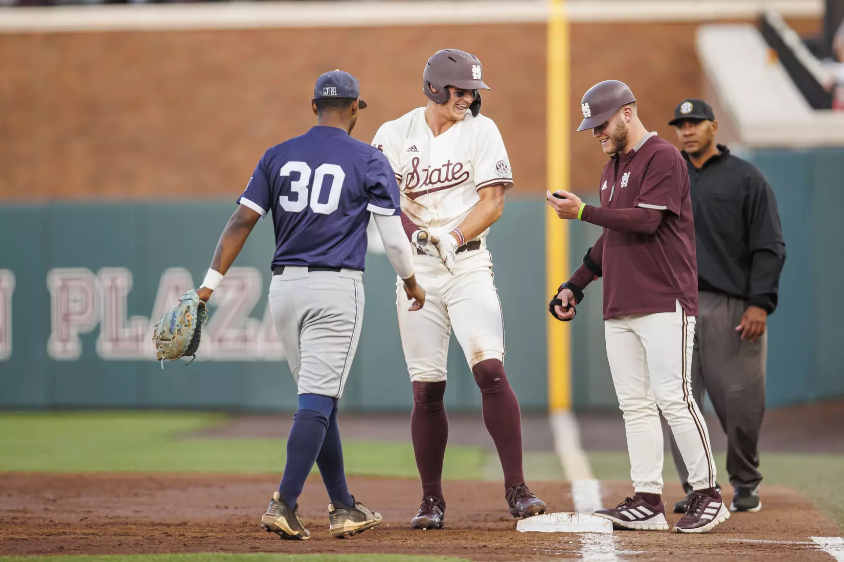STARKVILLE, MS - April 19, 2022 - Mississippi State Outfielder Brad Cumbest (#33) and Pitcher Landon Sims (#23) during the game between the Jackson State Tigers and the Mississippi State Bulldogs at Dudy Noble Field at Polk-Dement Stadium in Starkville, MS. Photo By Sloane Bush