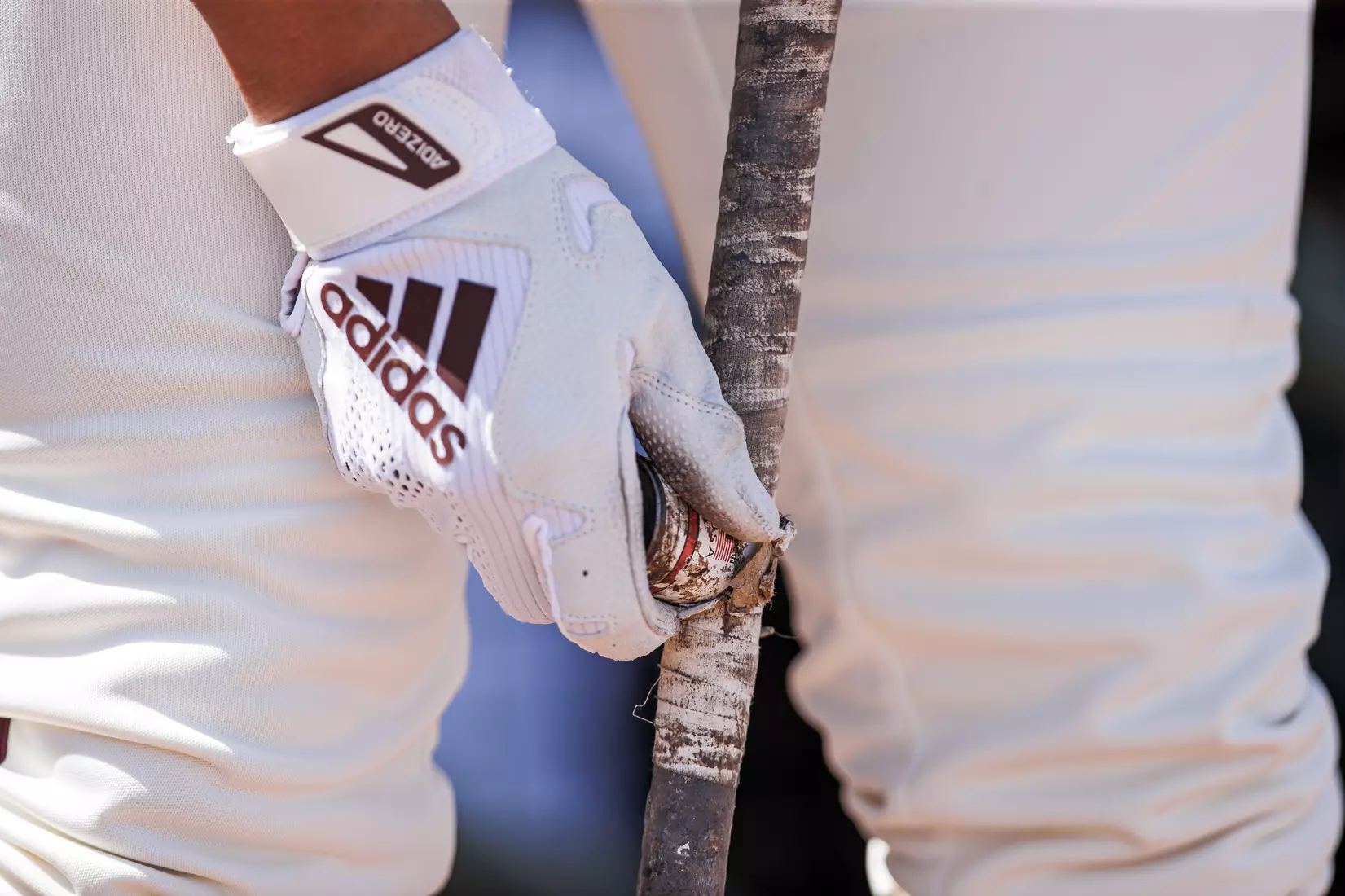 STARKVILLE, MS - April 26, 2022 - Pine tar being applied to a bat handle before the game between the Mississippi State Bulldogs and the Ole Miss Rebels at Trustmark Park in Pearl, MS. Photo By Kevin Snyder
