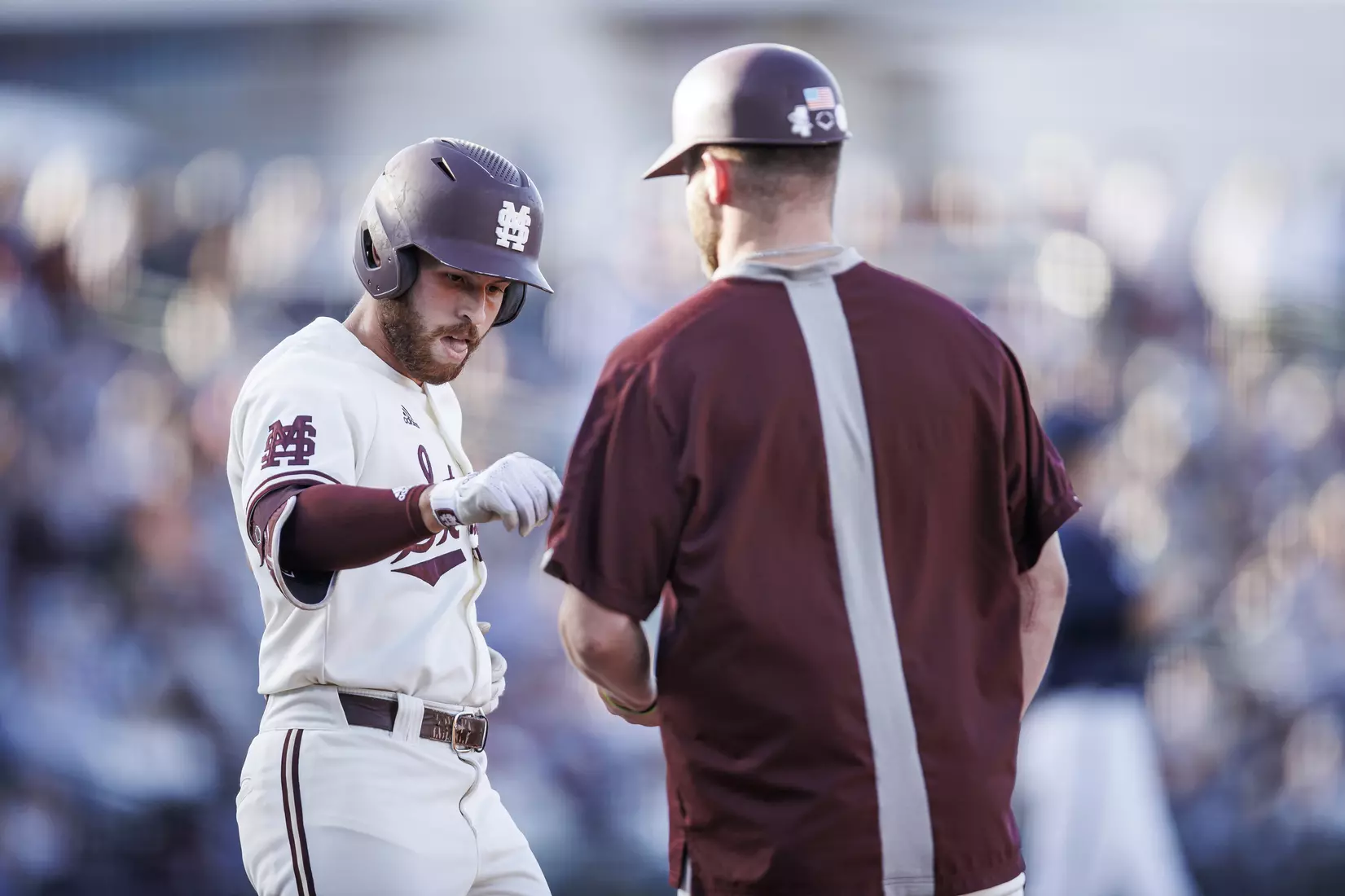 STARKVILLE, MS - April 26, 2022 - Mississippi State Infielder Luke Hancock (#20) and Mississippi State Pitcher Landon Sims (#23) during the game between the Mississippi State Bulldogs and the Ole Miss Rebels at Trustmark Park in Pearl, MS. Photo By Kevin Snyder