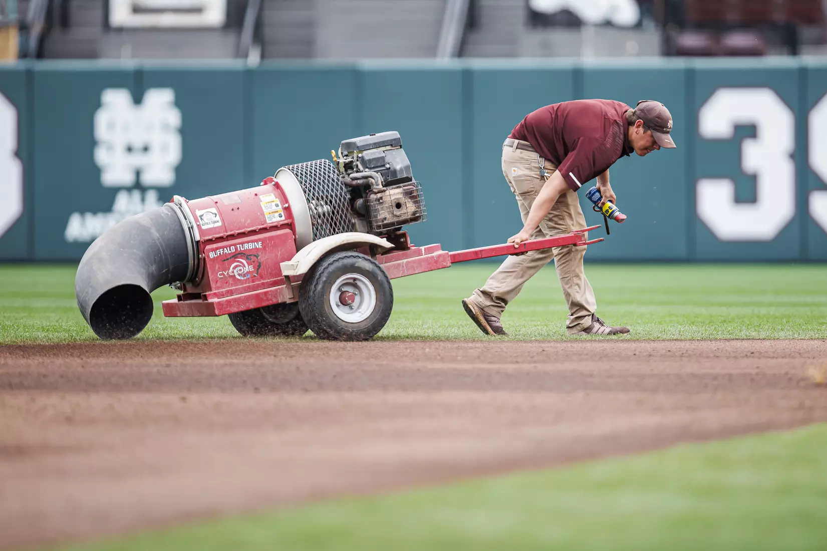 STARKVILLE, MS - February 22, 2022 - Mississippi State grounds crew preparing the field before the game between the University of Arkansas at Pine Bluff Golden Lions and the Mississippi State Bulldogs at Dudy Noble Field at Polk-Dement Stadium in Starkville, MS. Photo By Kevin Snyder
