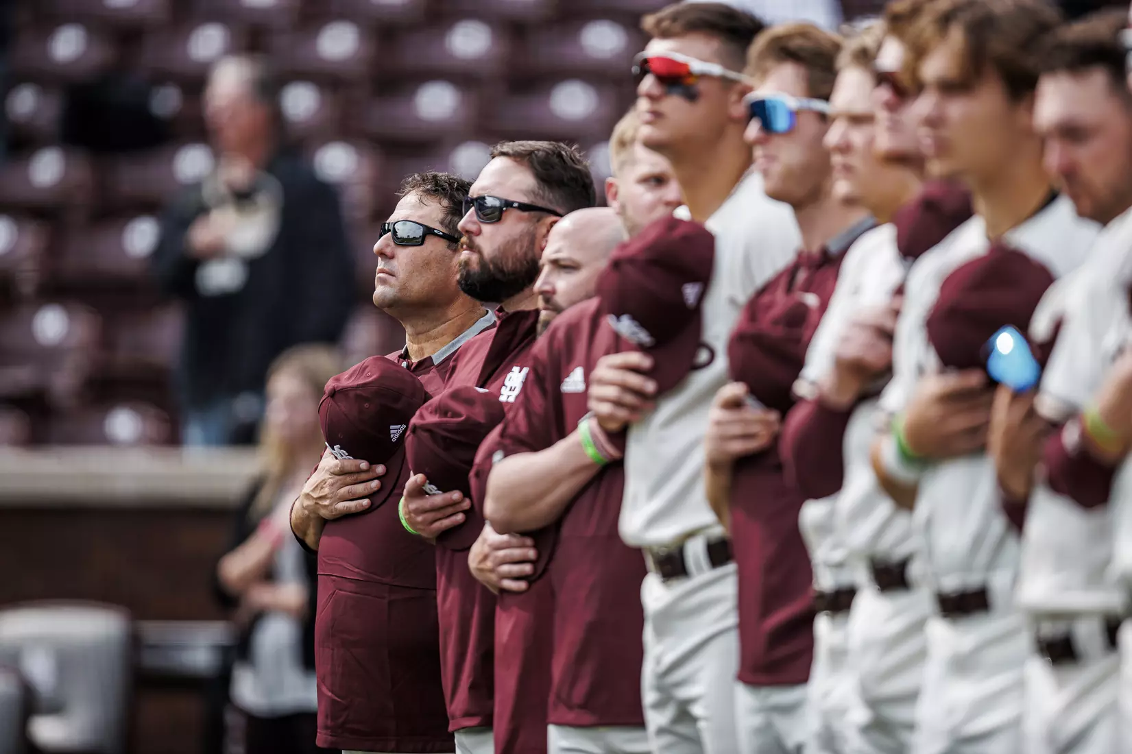 STARKVILLE, MS - February 22, 2022 - Mississippi State Head Coach Chris Lemonis during the National Anthem before the game between the University of Arkansas at Pine Bluff Golden Lions and the Mississippi State Bulldogs at Dudy Noble Field at Polk-Dement Stadium in Starkville, MS. Photo By Kevin Snyder