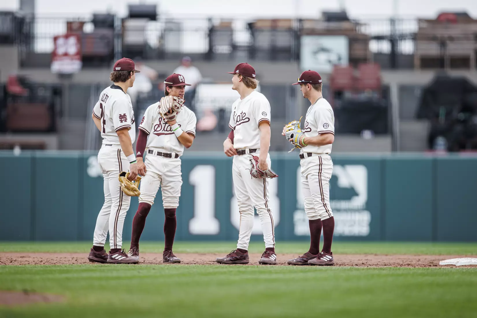 STARKVILLE, MS - February 22, 2022 - Mississippi State Infielder Slate Alford (#24), Mississippi State Infielder Tanner Leggett (#31), Mississippi State Infielder/Outfielder Hunter Hines (#44), and Mississippi State Infielder Davis Meche (#12) during the game between the University of Arkansas at Pine Bluff Golden Lions and the Mississippi State Bulldogs at Dudy Noble Field at Polk-Dement Stadium in Starkville, MS. Photo By Kevin Snyder