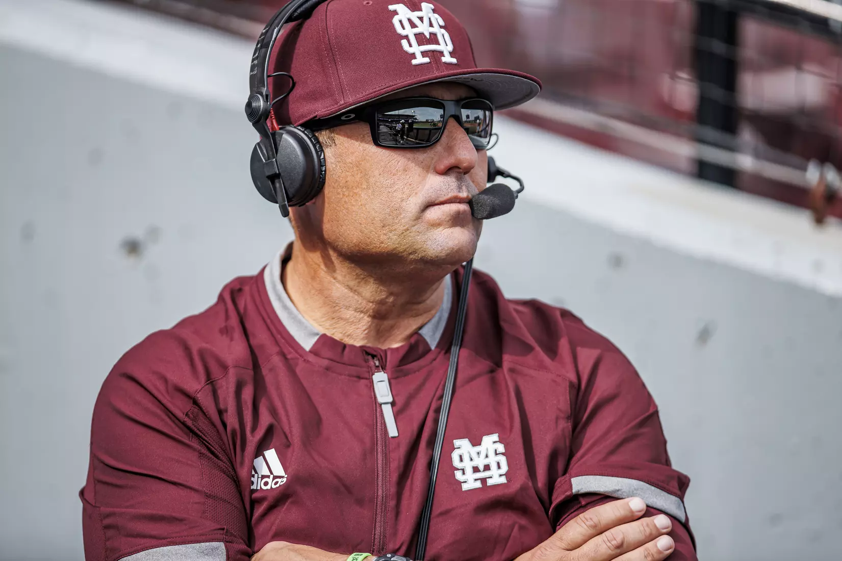 STARKVILLE, MS - February 22, 2022 - Mississippi State Head Coach Chris Lemonis on the headset after the game between the University of Arkansas at Pine Bluff Golden Lions and the Mississippi State Bulldogs at Dudy Noble Field at Polk-Dement Stadium in Starkville, MS. Photo By Kevin Snyder