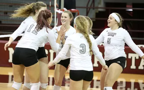 Team Celebrates Set Win Over Texas A&M On Nov. 22.
