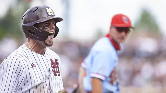 Tanner Allen celebrates after a three-run triple against Ole Miss