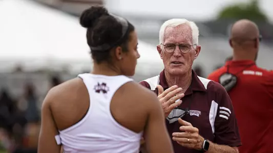 Mississippi State assistant track & field coach Steve Thomas chats with one of his athletes earlier this year.