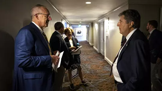 Greg Sankey and Mike Leach