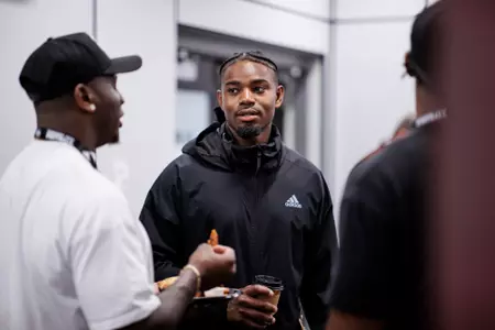 STARKVILLE, MS - April 16, 2022 - Tim Washington speaks with Willie Gay during a former football playersâ?? brunch during the Maroon & White Spring Game at Davis Wade Stadium at Scott Field in Starkville, MS. Photo By Austin Perryman