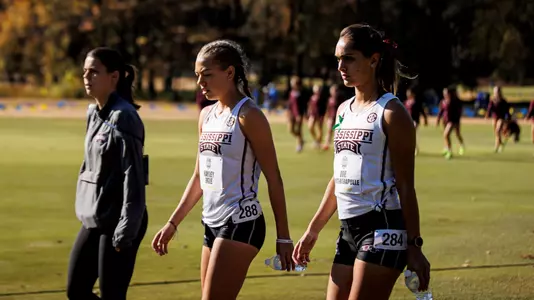 STARKVILLE, MS - October 28, 2022 - The Mississippi State Bulldogs Assistant Cross Country and Track coach Ernie Stenman-Fahey, Hayley Ogle, and Zoe Brito during the SEC Cross Country Championship at the Ole Miss Golf Course in Oxford, MS. Photo By Mike Mattina