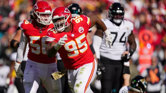 Nov 13, 2022; Kansas City, Missouri, USA; Kansas City Chiefs defensive tackle Chris Jones (95) celebrates with defensive end George Karlaftis (56) after a sack during the first half against the Jacksonville Jaguars at GEHA Field at Arrowhead Stadium. Mandatory Credit: Jay Biggerstaff-USA TODAY Sports
