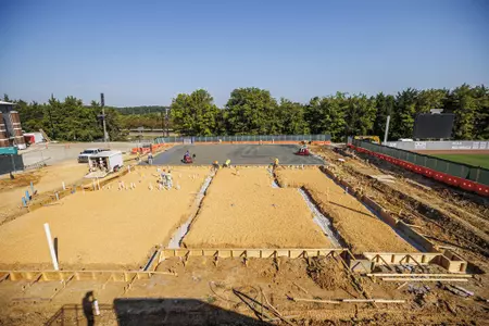 STARKVILLE, MS - September 22, 2022 - Construction workers finish the new concrete slab during construction at the MSU Softball Indoor Facility at Mississippi State University in Starkville, MS. Photo By Kevin Snyder