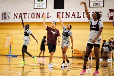 STARKVILLE, MS - June 23, 2022 - Mississippi State Forward Nyayongah Gony (#24), Mississippi State Head Coach Sam Purcell, Mississippi State Guard Kourtney Weber (#11) and Mississippi State Forward Denae Carter (#25) during individual summer workouts at Humphrey Coliseum in Starkville, MS. Photo By Mike Mattina