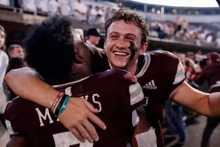 STARKVILLE, MS - November 05, 2022 - Mississippi State Quarterback Will Rogers (#2) hugs Mississippi State Running Back Jo'quavious "Woody" Marks (#7) during the game between the Auburn Tigers and the Mississippi State Bulldogs at Davis Wade Stadium at Scott Field in Starkville, MS. Photo By Will Porada