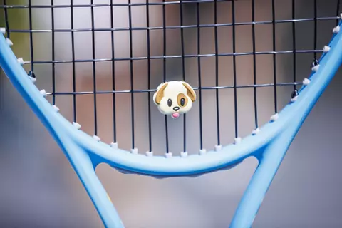 STARKVILLE, MS - March 20, 2022 - A bulldog shock absorber on Mississippi State’s Emmanouela Antonaki’s racket before the match between the Alabama Crimson Tide and the Mississippi State Bulldogs at the AJ Pitts Tennis Centre in Starkville, MS. Photo By Kevin Snyder
